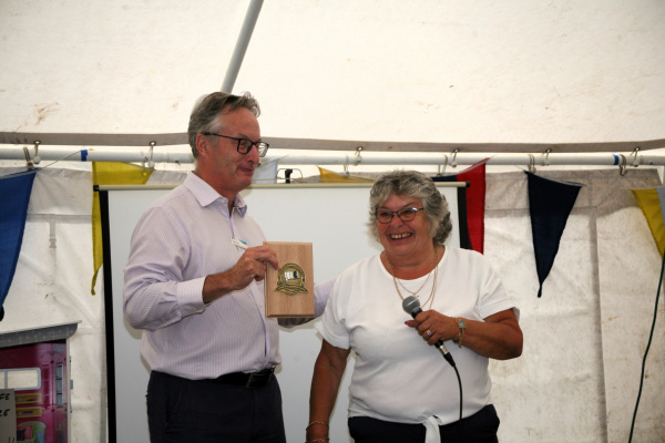 Richard Parry being presented with plaque by Hazel Owen